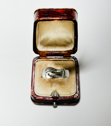 sterling silver buckle ring in a leather ring box with cream felt interior