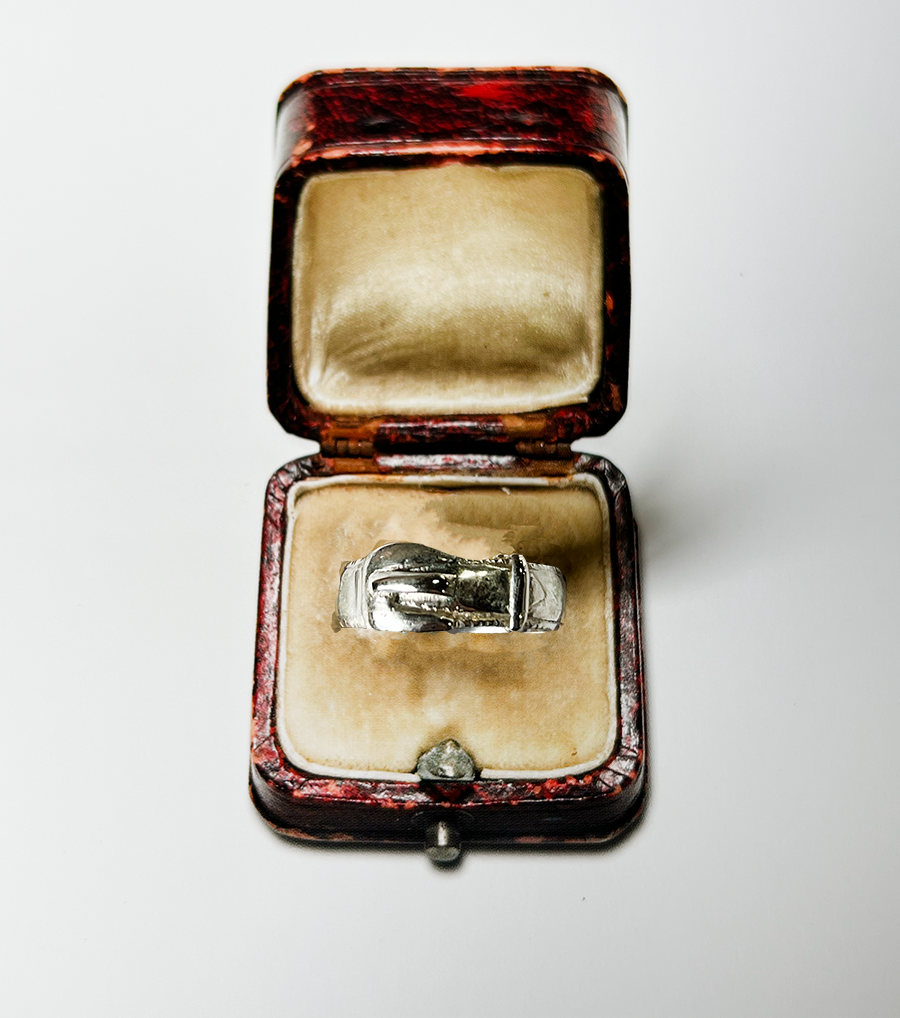 sterling silver buckle ring in a leather ring box with cream felt interior