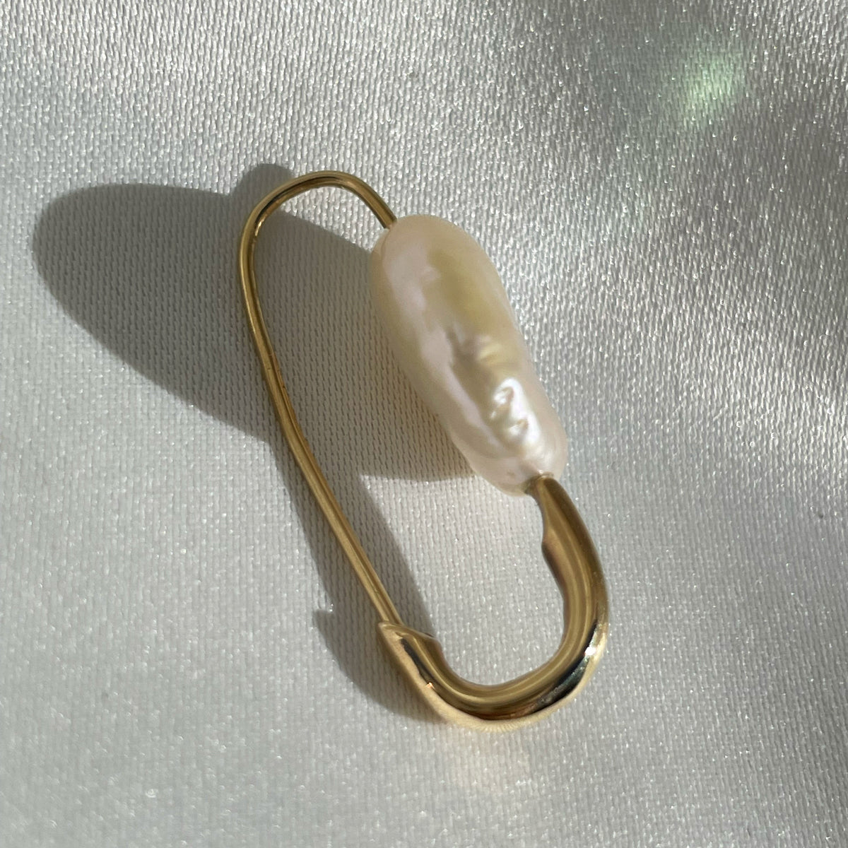 Solid gold safety pin earrings top
